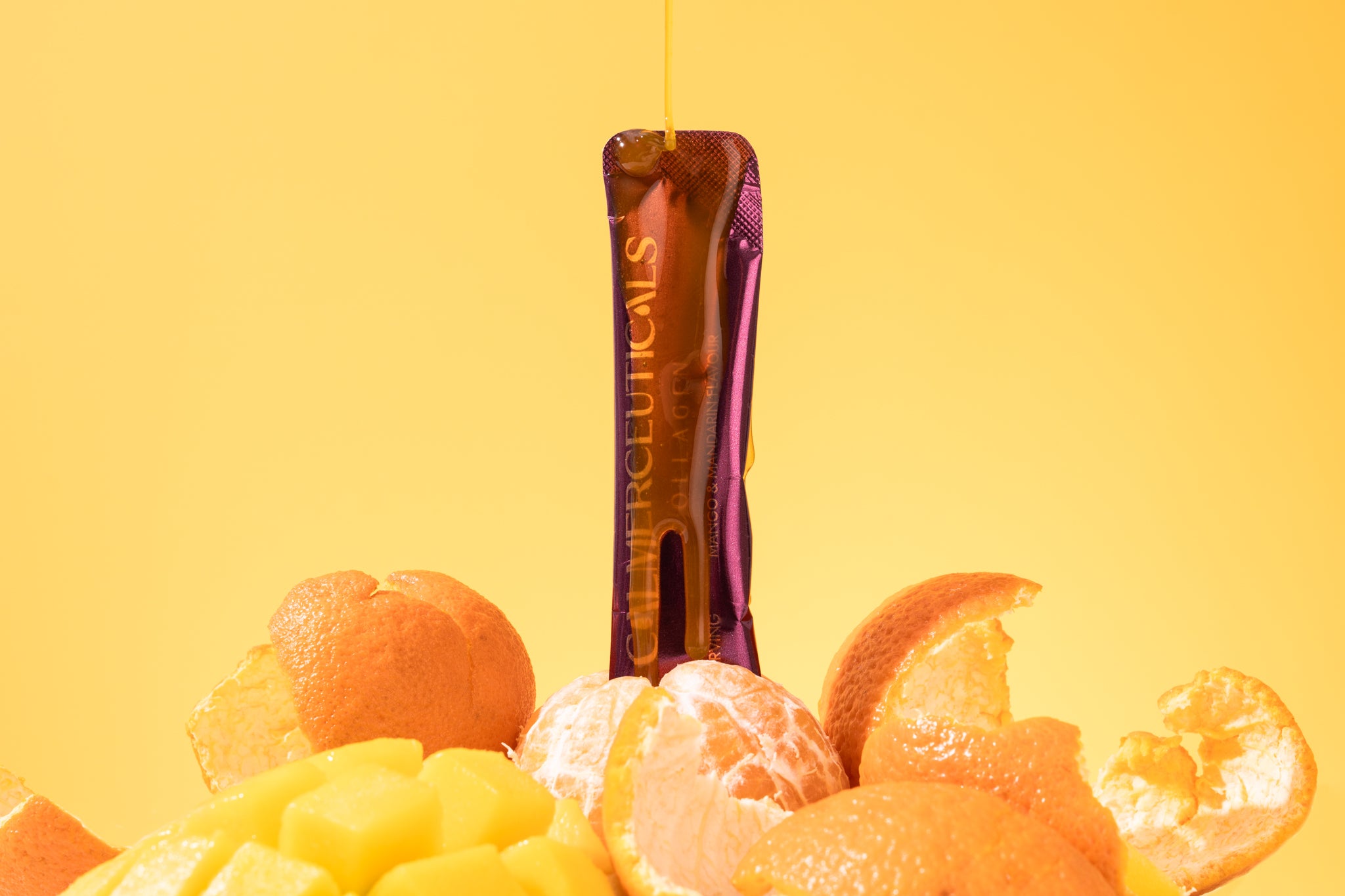 VERISOL® Enhanced Liquid Collagen sachet with mango and mandarin on a yellow background, highlighting premium Australian marine collagen.